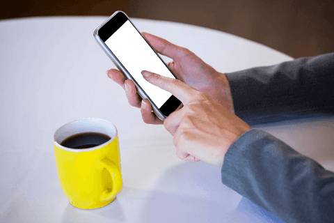 Woman Using Smartphone at Table with Coffee Cup - Download Free Stock Videos Pikwizard.com