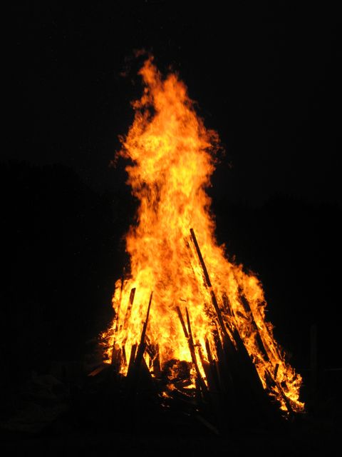 Towering Bonfire Blaze Against Night Sky - Download Free Stock Photos Pikwizard.com