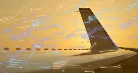 Airplane Wing and Fin With Digital Overlays During Sunset