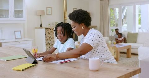 African American Family Homeschooling with Tablet Learning