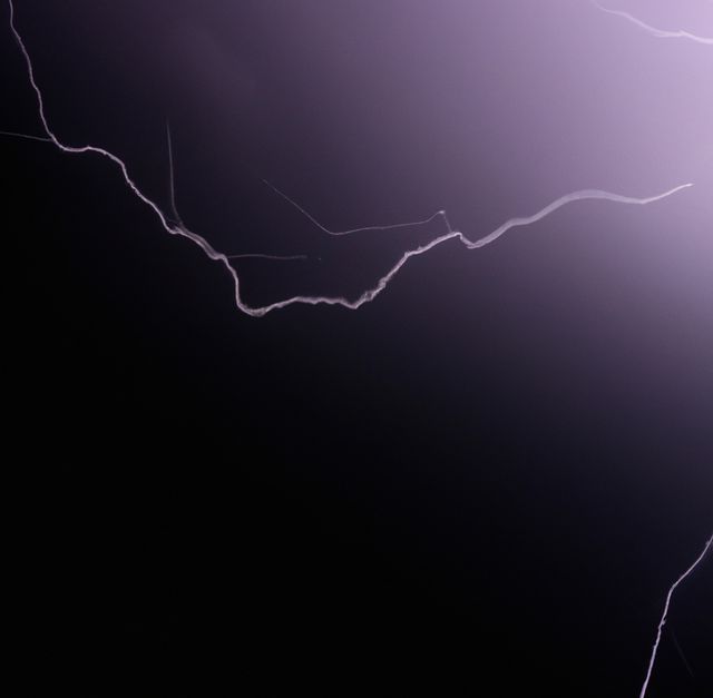 Image of thunder lightning against grey stormy sky with copy space. Nature, storms and weather concept.