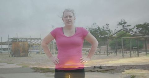 Woman Navigating Rustic Obstacle Course with Determination
