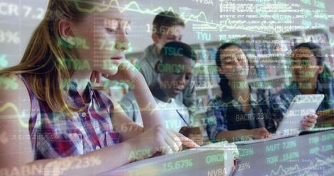 Education and finance: students analyzing stock market data in library