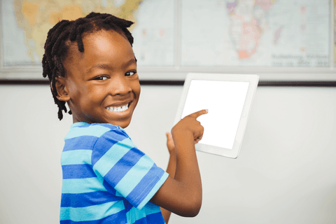 smiling boy pointing at transparent digital tablet screen - Download Free Stock Videos Pikwizard.com