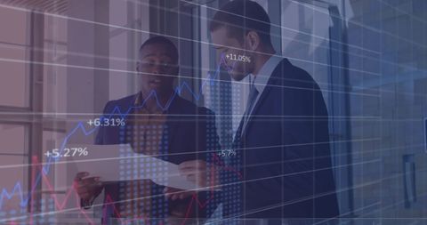 Business Team Analyzing Financial Data with Graphs