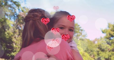 Heartfelt Embrace Between Mother and Daughter with Love Graphics