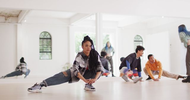 Professional group of diverse male and female dancers exercising in dance studio. Activity, lifestyle and dance concept.