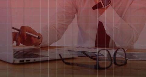 Professional businessman strategically working on laptop in office workspace