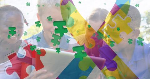 Diverse children engaging with tablet and puzzle pieces celebrating autism awareness