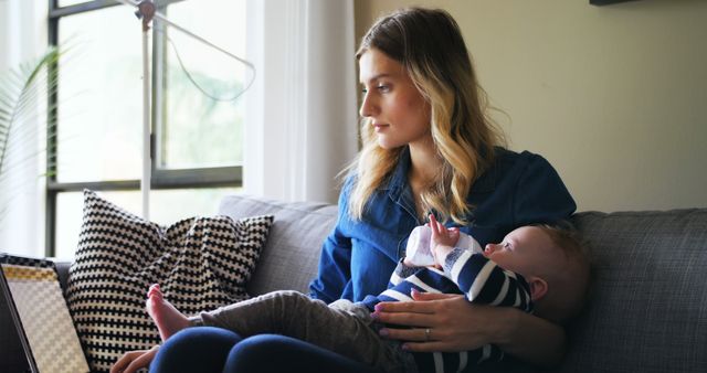 Mother Working Remote While Holding Baby - Download Free Stock Images Pikwizard.com