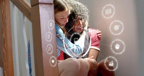 Girls Embracing On Stairs with Technology and Education Icons
