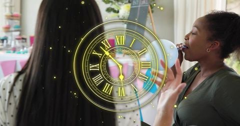 Woman celebrating with cupcake and balloons at indoor party with golden clock overlay