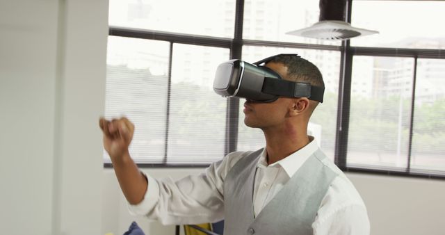 Young African American Man Using Virtual Reality Headset in Office - Download Free Stock Images Pikwizard.com