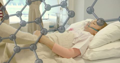 Pediatric patient receiving oxygen while parent holding hand with molecular health overlay