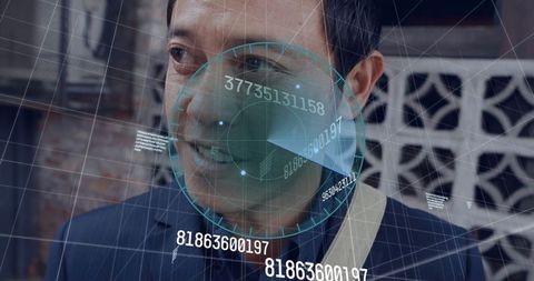 Asian man analyzing holographic data in urban environment