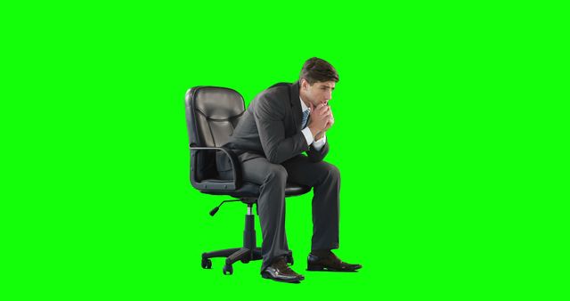 Businessman in deep thought sitting on office chair with green screen background - Download Free Stock Images Pikwizard.com