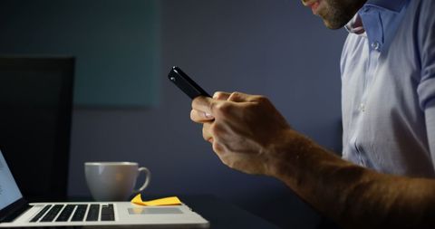 Business Professional Multitasking with Phone and Laptop in Office - Download Free Stock Images Pikwizard.com