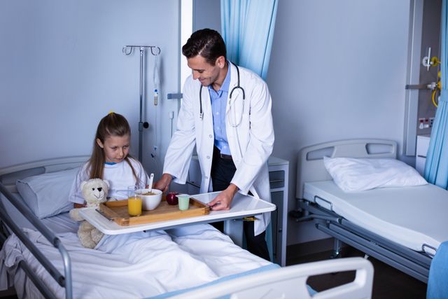 Doctor serving breakfast to young girl in hospital bed, showing compassionate healthcare. Ideal for use in medical, healthcare, and pediatric care promotions, illustrating patient care and recovery. Suitable for articles on hospital experiences, pediatric medicine, and doctor-patient relationships.