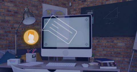 Modern industrial workspace with glowing digital icons on desktop monitor and brick wall