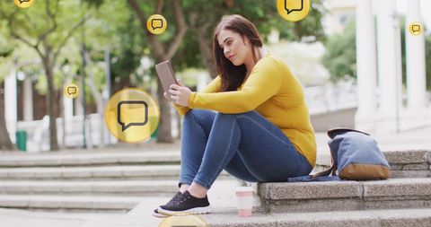 Woman Engaging on Smartphone in Outdoor Social Media Interaction