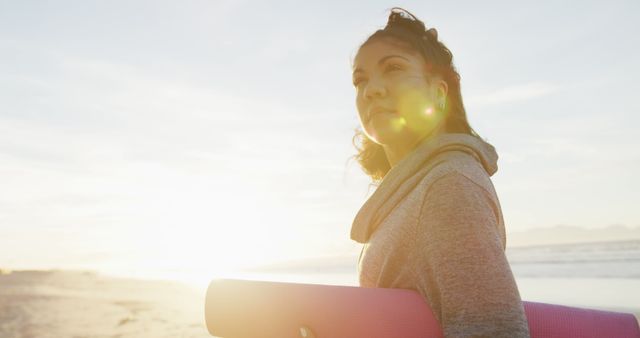 Woman Holding Yoga Mat on Beach at Sunrise - Download Free Stock Images Pikwizard.com