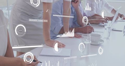 Business team collaborating and analyzing holographic data during boardroom brainstorming