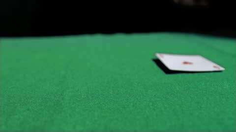 Ace of Hearts Landing on Green Casino Table in Slow Motion