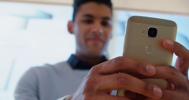 Young Man Using Smartphone Indoors - Download Free Stock Images Pikwizard.com