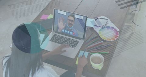 Designer Engaging in Video Call with Overlaid Financial Graphs - Download Free Stock Images Pikwizard.com