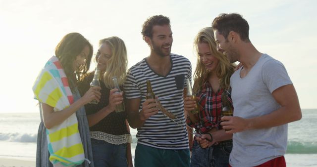 Friends Enjoying Beach Gathering with Drinks - Download Free Stock Images Pikwizard.com