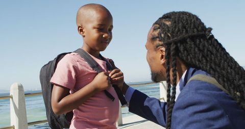 Father and Son Bonding Near Ocean