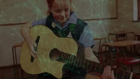 Child Practicing Guitar Chords in Music Class