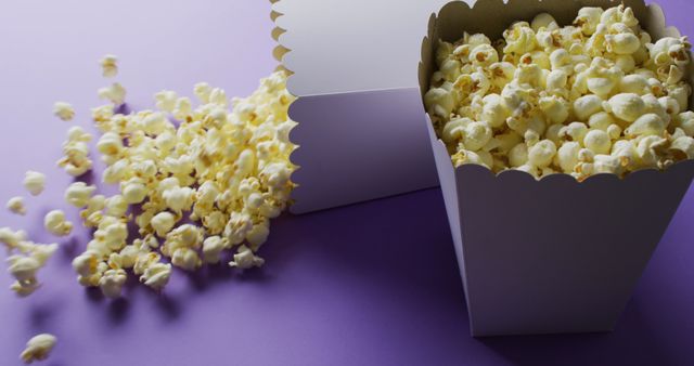 Close Up of Two Popcorn Tubs on Purple Background - Download Free Stock Images Pikwizard.com