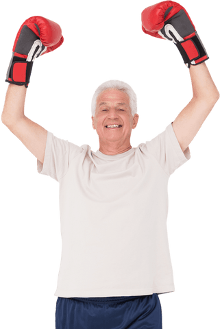 Senior man in red boxing gloves on white background standing strong