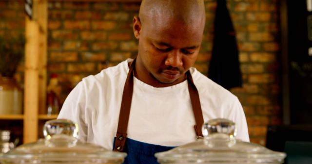 Chef Concentrating on Cooking in Rustic Kitchen - Download Free Stock Images Pikwizard.com