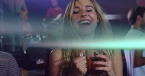 Woman Enjoying Night Out with Live Music and Drinks