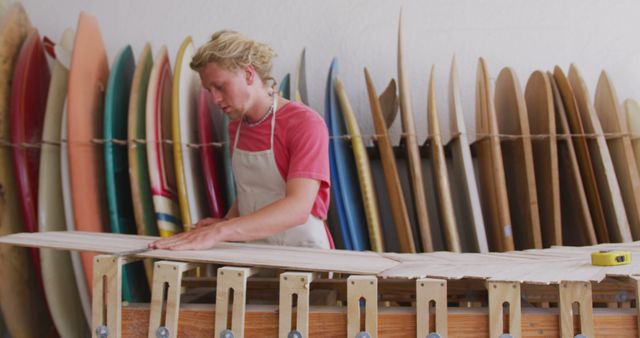 Male Surfboard Maker Working with Wooden Surfboard in Workshop - Download Free Stock Images Pikwizard.com