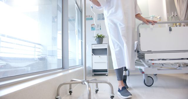 Hospital Patient with Prosthetic Leg Moving with IV Drip Stand - Download Free Stock Images Pikwizard.com