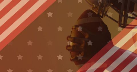 American Football Player Holding Ball Against USA Flag Backdrop
