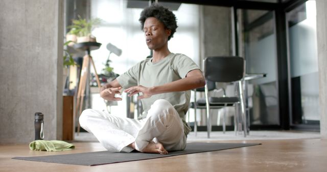 Man Practicing Meditation in Modern Urban Apartment - Download Free Stock Images Pikwizard.com