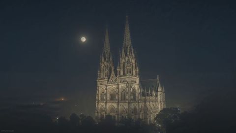 Gothic Cathedral Illuminated by Moonlight with Twin Spires