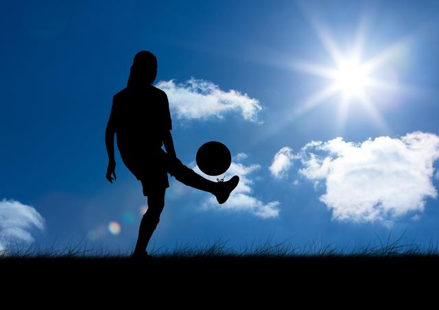 Digital composition of silhouette of woman playing with ball against sky background