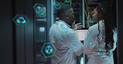 Engineers Collaborating on Server Rack with Digital Holograms