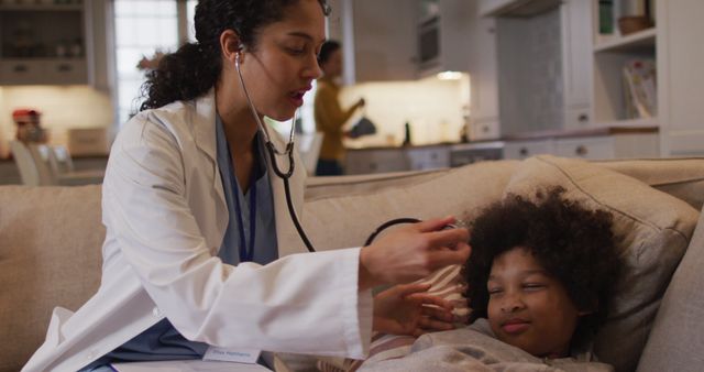 Female Doctor Examining Young Boy at Home with Stethoscope - Download Free Stock Images Pikwizard.com