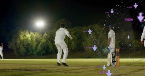 Nighttime cricket bowler delivering on floodlit pitch with data analytics overlay