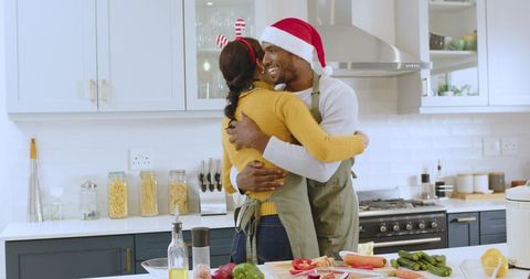 Festive Couple Embracing in Modern Kitchen