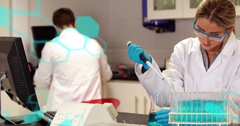 Scientist Conducting Experiment with Pipette in Modern Laboratory