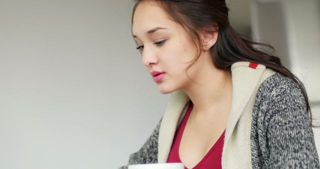 Young Woman Sipping Coffee and Relaxing at Home - Download Free Stock Images Pikwizard.com