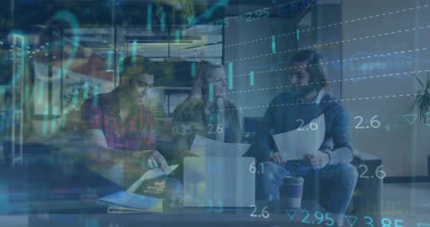Team Analyzing Financial Data with Digital Overlay in Modern Workspace