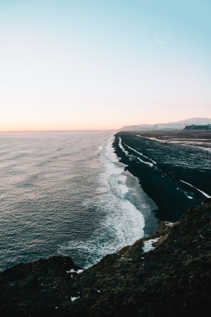 Scenic Coastal View at Sunset with Black Sand Beach and Horizon - Download Free Stock Images Pikwizard.com